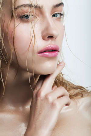 blond woman with water dropsの写真素材