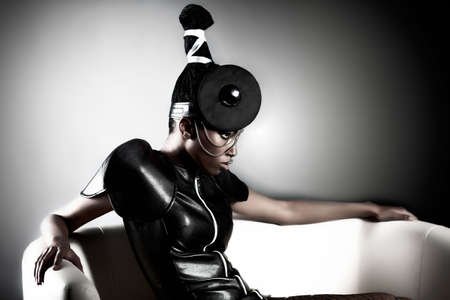 Beautiful african woman sitting whith fashion make-upの写真素材