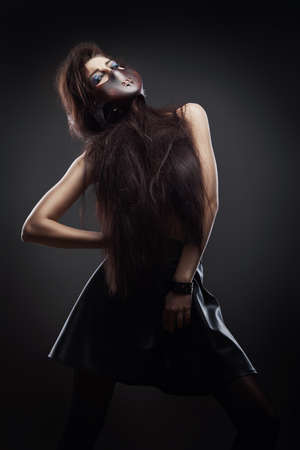 woman in leather mask and skirtの写真素材