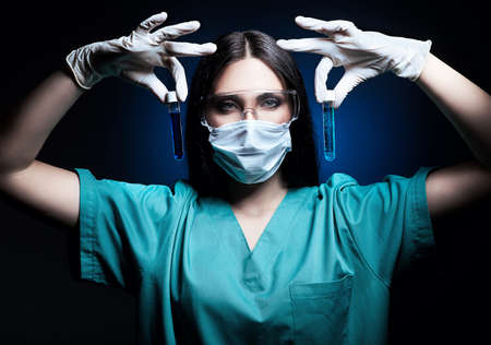 scientist holding tubes in handsの写真素材