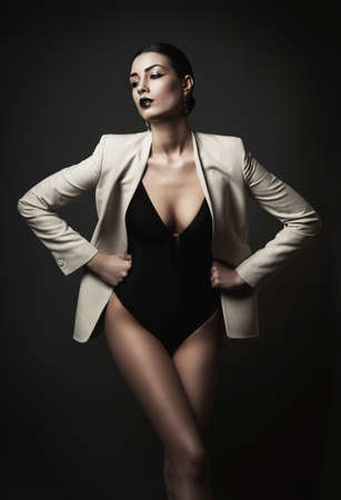 woman with black lips in white blazerの写真素材