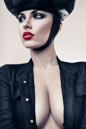 hot woman in jacket and black hatの写真素材