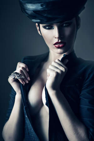 mysterious woman in black with ring and hatの写真素材