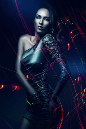 woman in colourful lightsの写真素材