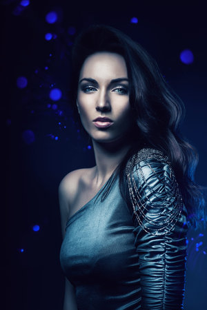 woman in dress in blue lightの写真素材