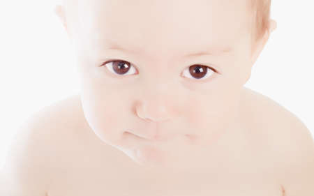 portrait of adorable baby on the white backgroundの写真素材