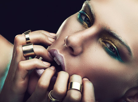 woman with fingers on lips