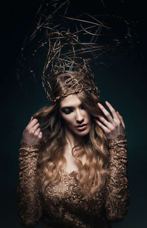 pretty woman with gold accessory on headの写真素材