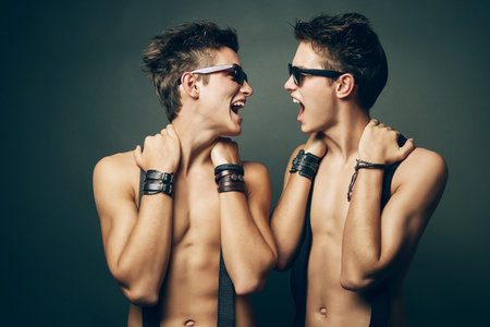 two smiling men with torsoの写真素材