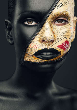 woman with zip and newspaper make-upの写真素材