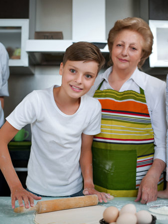 Grandmother with grandchild baking cookies prepare dough