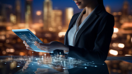 Businessman working with a digital phone or tablet on blurry dark bokeh background, Social media technology conceptの素材