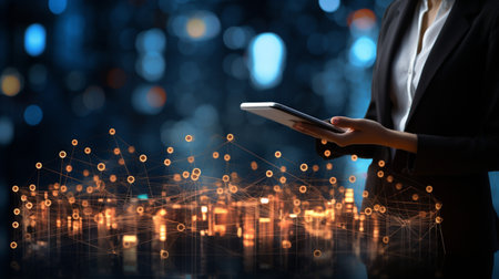 Businessman working with a digital phone or tablet on blurry dark bokeh background, Social media technology conceptの素材
