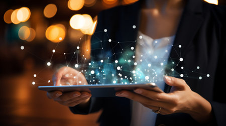 Businessman working with a digital phone or tablet on blurry dark bokeh background, Social media technology conceptの素材