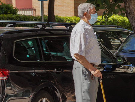 Madrid / Spain - 06/18/2020: Retired man on the street. New situation in Spain about the pandemic of Covid-19. People are using mask in their new life routine.のeditorial素材