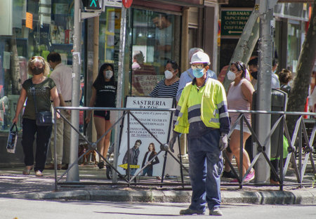 Madrid / Spain - 06/18/2020: Worker in the middle of the street. New situation in Spain about the...