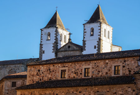 perspective of ancient city of Caceres with two big tower in a sunny day