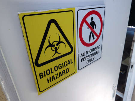 Biological Hazard, authorized personnel only, sign on a door of a bunkerの写真素材