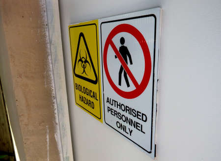 Biological Hazard, authorized personnel only, sign on a door of a bunkerの写真素材