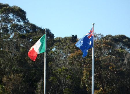 italian and austrlian flags flying together