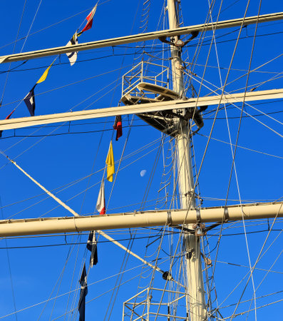 Mast of sailing ship against a blue sky. Image assembled from few frames