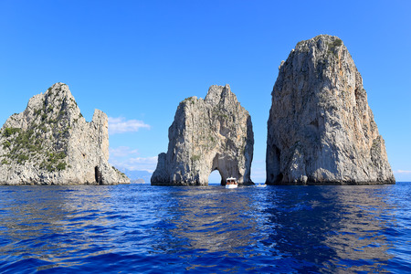 Faraglioni - three famous giant rocks, Capri island Italyの写真素材