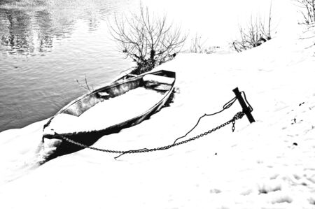 Abandoned boat in the snowの写真素材