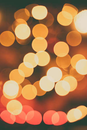 Out of focus christmas bokeh lights of a christmas tree.の写真素材