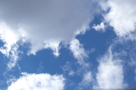 white clouds on blue sky background imageの写真素材