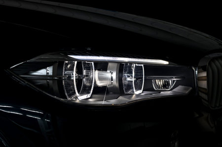 Modern car headlight with backlight. Exterior detail.