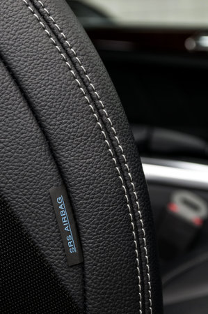 Airbag label on the side of a car leather seat.の写真素材