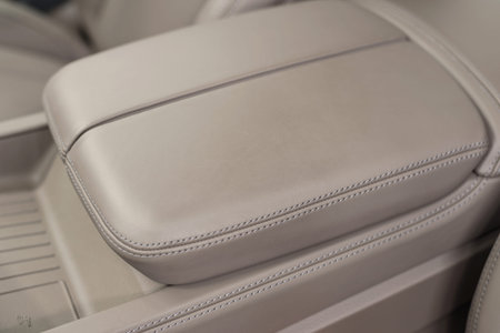 Leather armrest. Auto interior detail.