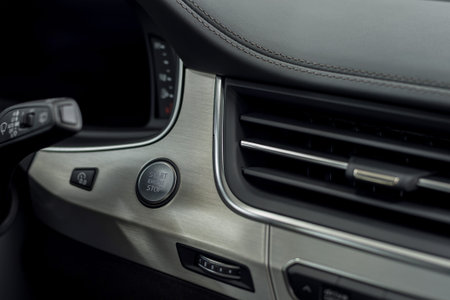 New car interior detail. Engine start and stop button.