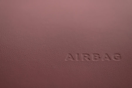Word Airbag sign on car plastic dashboard. Interior detail.の写真素材