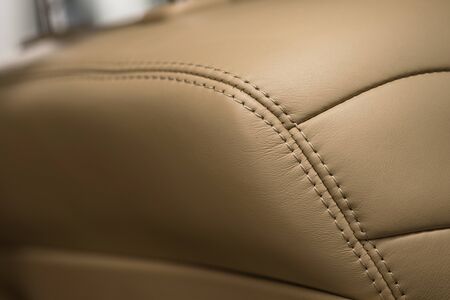 Car interior detail background. Part of leather seat. Macro photo.の写真素材