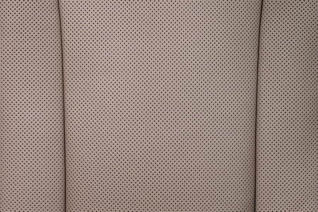 Modern car perforated leather background. Interior detail. Macro photo.の写真素材