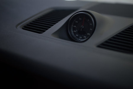 Dashboard stopwatch in sport car. Interior detail. Transportation background.