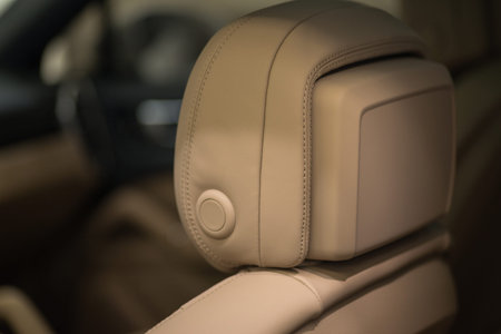 Modern car interior detail. Leather headrest. 