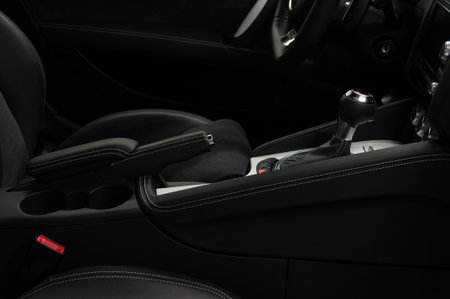 Shift lever in modern sport car. Car interior detail. Viev from passenger seat.