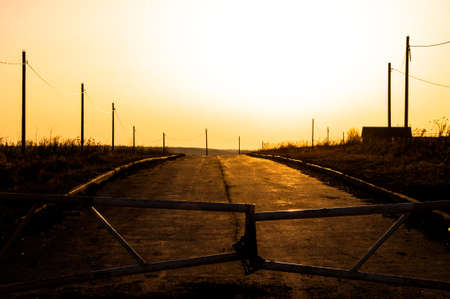 space of Russia ... Entry is closed. Farmland ahead. Spring Golden sunset.の写真素材