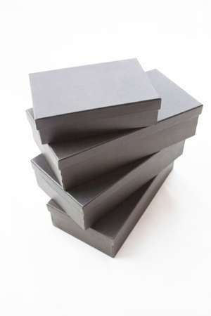 Black packaging boxes on a white background.の写真素材