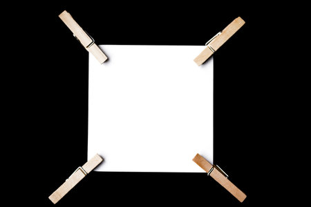 A reminder note pinned with a wooden peg on the side.の写真素材