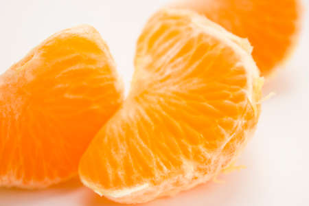Vibrant mandarin fruit on a white background.の写真素材