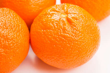 Vibrant mandarin fruit on a white background.の写真素材