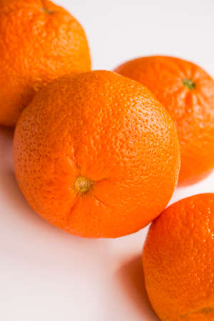 Vibrant mandarin fruit on a white background.の写真素材