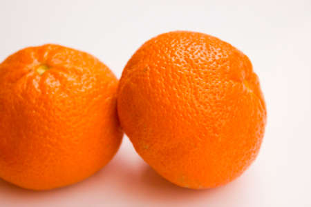 Vibrant mandarin fruit on a white background.の写真素材