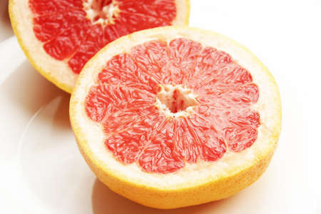 Fresh composition of yellow and red grapefruits.の写真素材