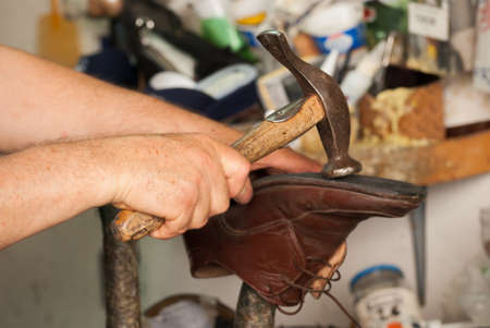 Shoemaker, repair of the soleの写真素材