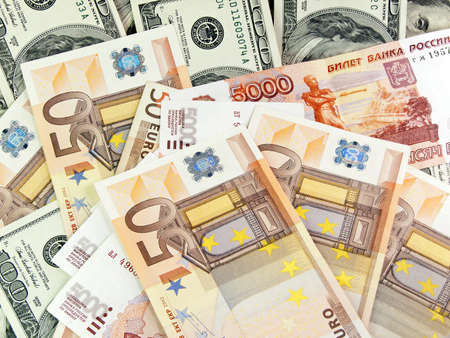 Heap from dollars of the Russian roubles and euroの写真素材