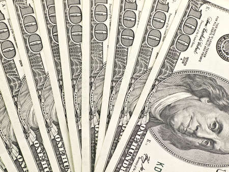 Heap from dollars denominations on 100 dollarsの写真素材